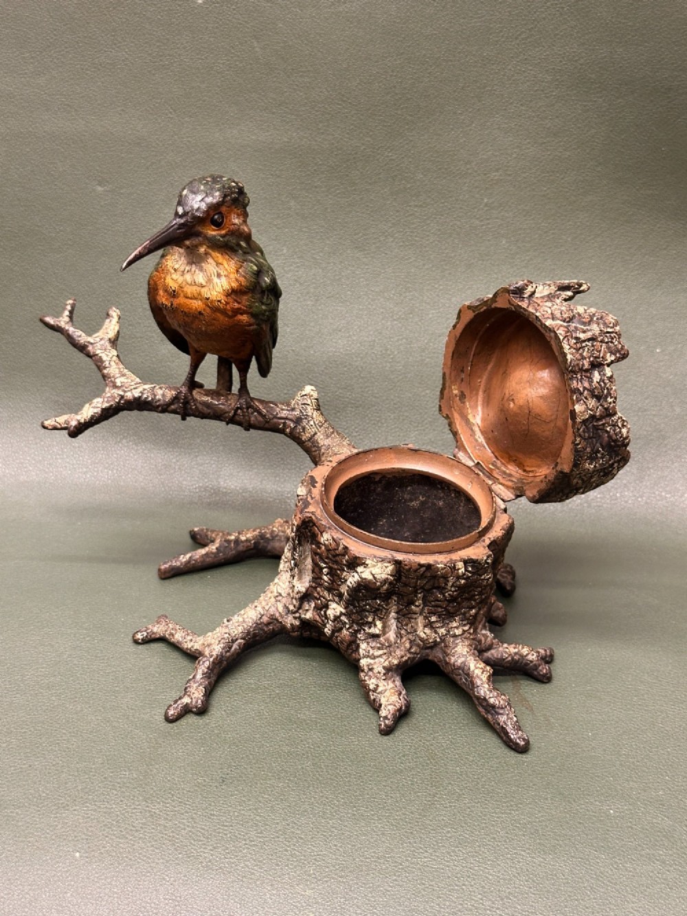 A cold painted bronze inkwell depicting a kingfisher bird perched on a branch above a tree stump base. View II