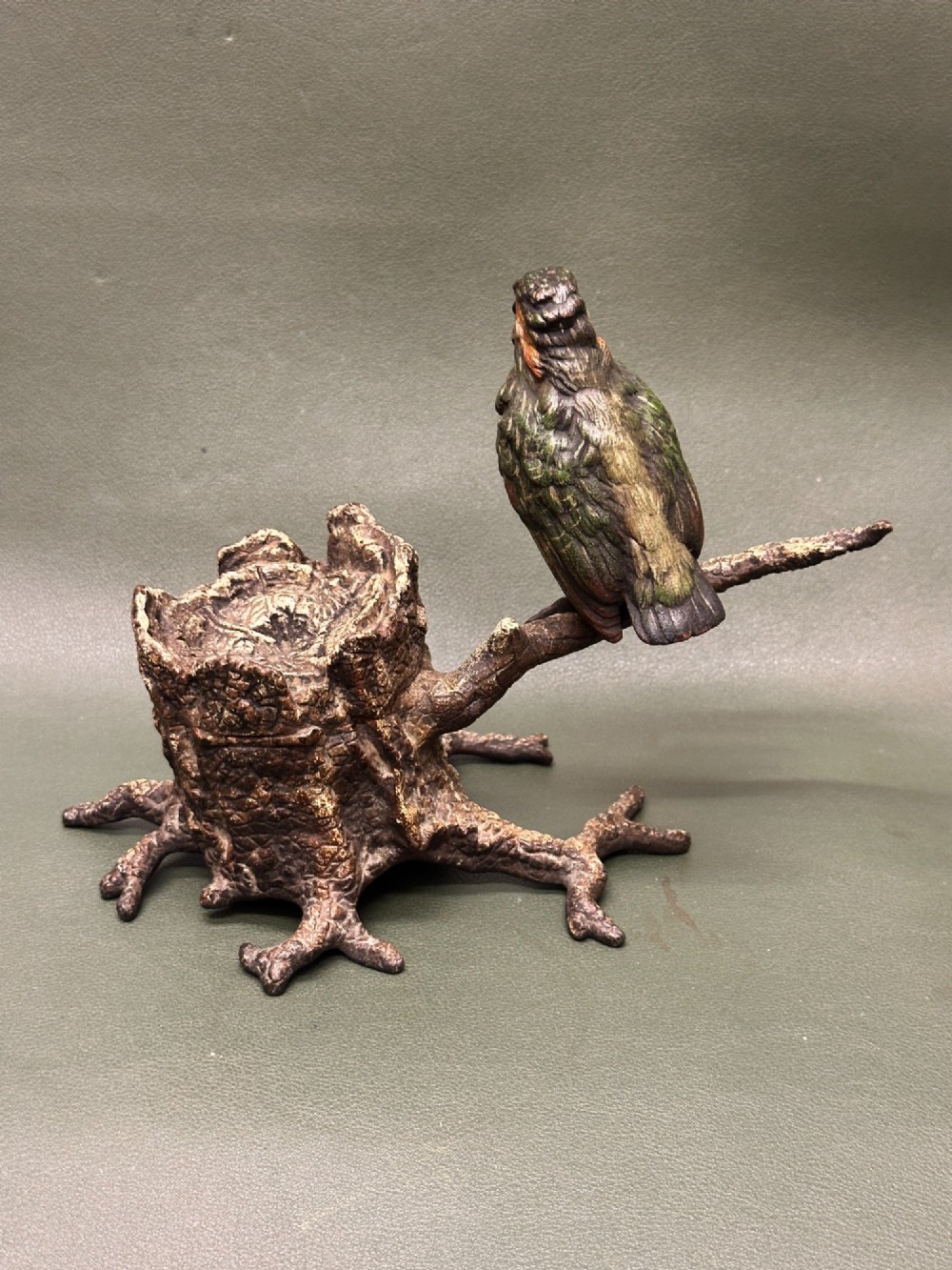 A cold painted bronze inkwell depicting a kingfisher bird perched on a branch above a tree stump base. View III