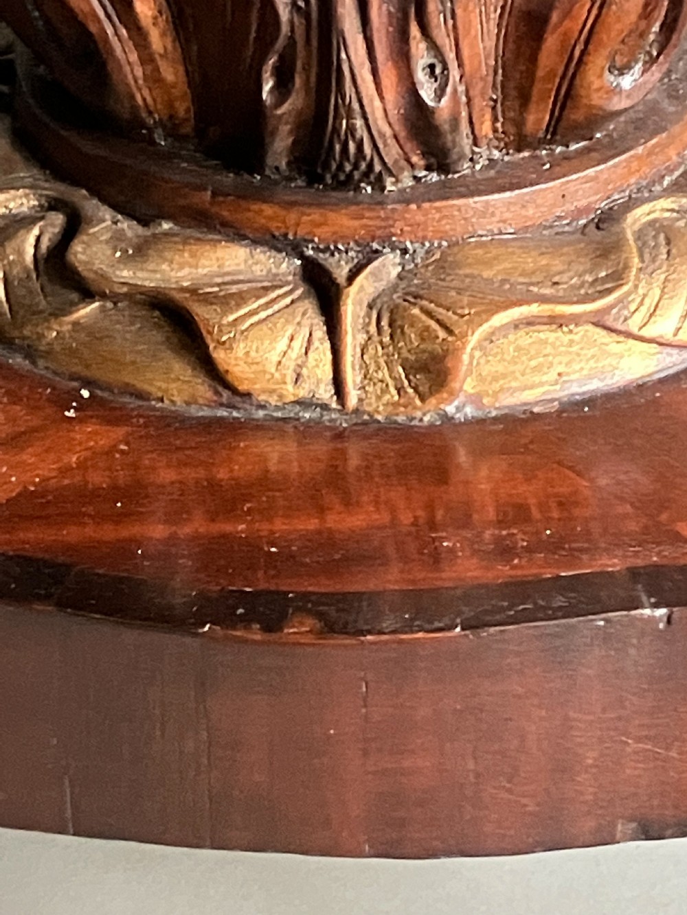 A circular mahogany centre table featuring a carved acanthus pedestal column and a quadform base with gilded claw feet. View VIII