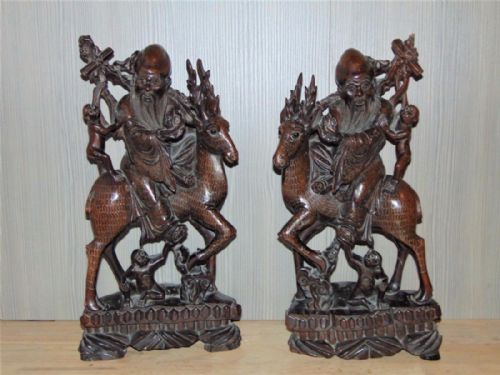 Pair of 19th Century Chinese Silver Inlaid Hardwood Immortals Riding Stags