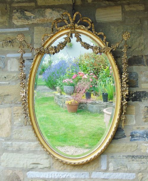 Good 19th Century Regency Style Oval Mirror in the Adams Taste