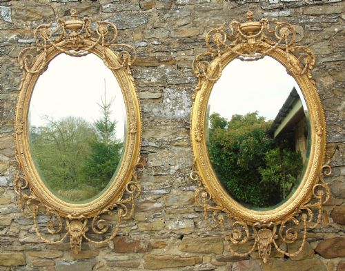 Outstanding Pair of Large Antique Gilt and Gesso Oval Mirrors in the Adam Style