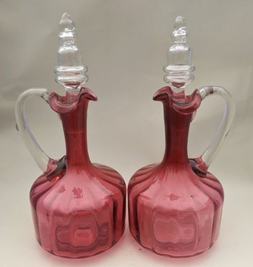 PAIR OF ANTIQUE CRANBERRY GLASS DECANTERS
