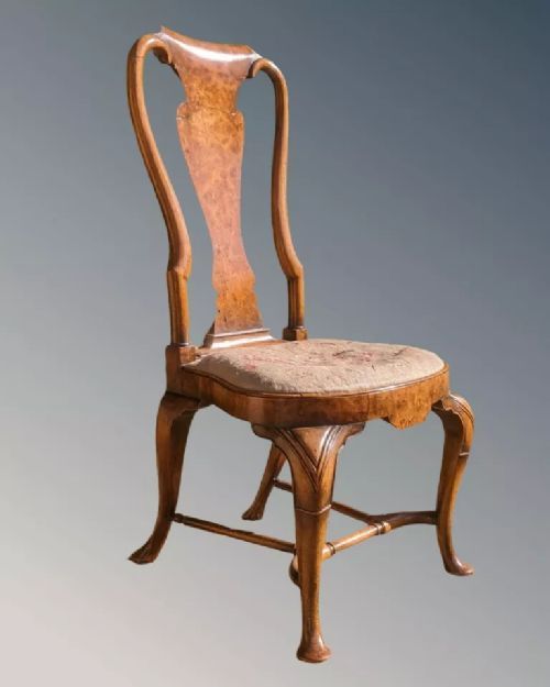 fig 1. A pair of Queen Anne walnut side chairs featuring splat backs, cabriole legs, and upholstered drop-in seats.