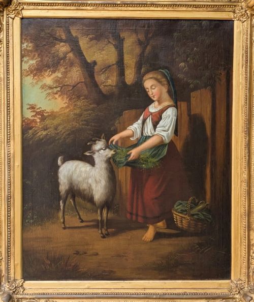 fig 1. An oil painting on canvas depicting a young girl feeding a goat outdoors, set within an ornate gilded frame.