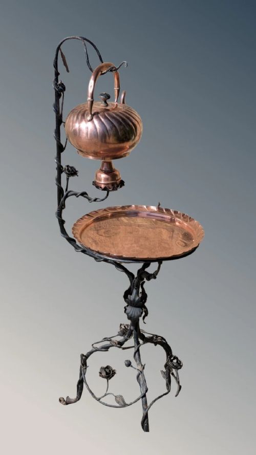 ARTS AND CRAFTS COPPER KETTLE AND TABLE ON WROUGHT IRON STAND