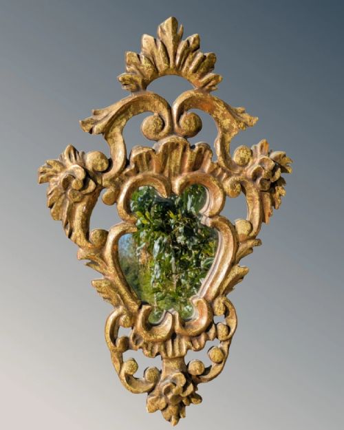 fig 1. A pair of French carved giltwood wall mirrors with intricate acanthus leaf cresting and pierced scrollwork framing central glass panels.
