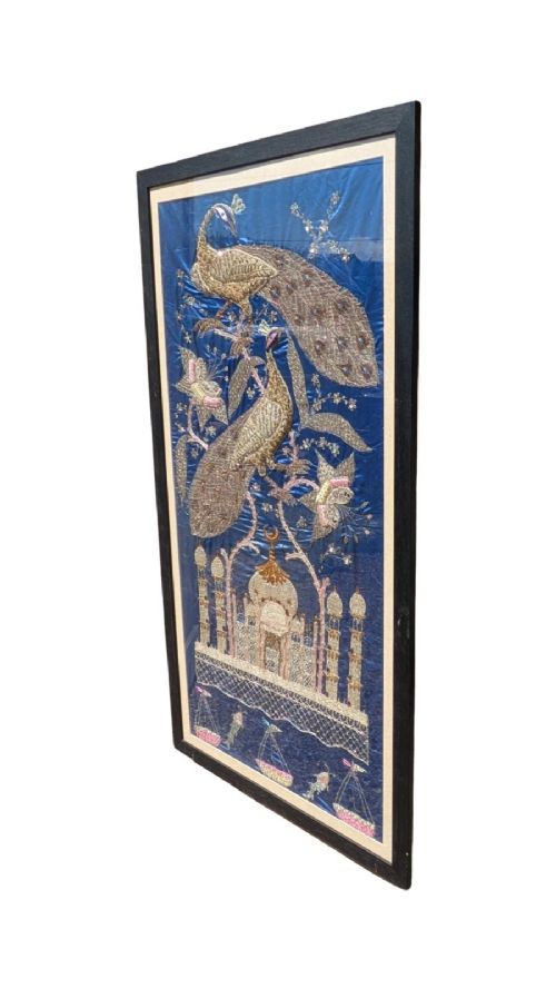 A framed vertical silk textile panel displaying metallic thread zardozi embroidery of peacocks, flowers, and the Taj Mahal on a cobalt blue ground. View II