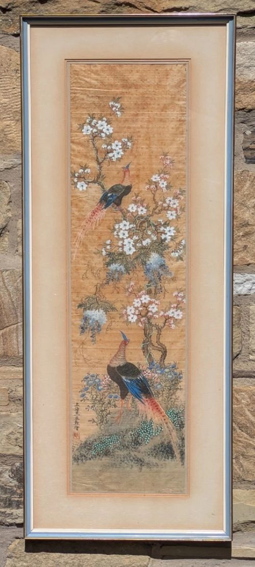 fig 1. A vertical framed Chinese watercolour on silk depicting two colourful pheasants among blossoming tree branches and floral foliage.
