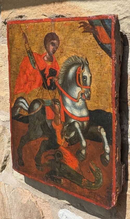 An 18th-century painted wooden icon depicting Saint George on horseback slaying a dragon against a gilded gold leaf background. View II
