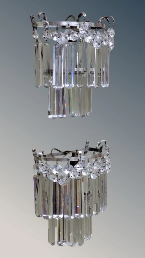 A pair of semi-circular wall lights featuring cascading tiers of clear cut crystal rectangular prisms suspended from silver-toned metal frames. View III