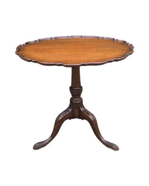 fig 1. A Georgian mahogany tilt-top table with a scalloped piecrust edge shown in a raised vertical position above a turned pedestal and carved tripod cabriole legs.
