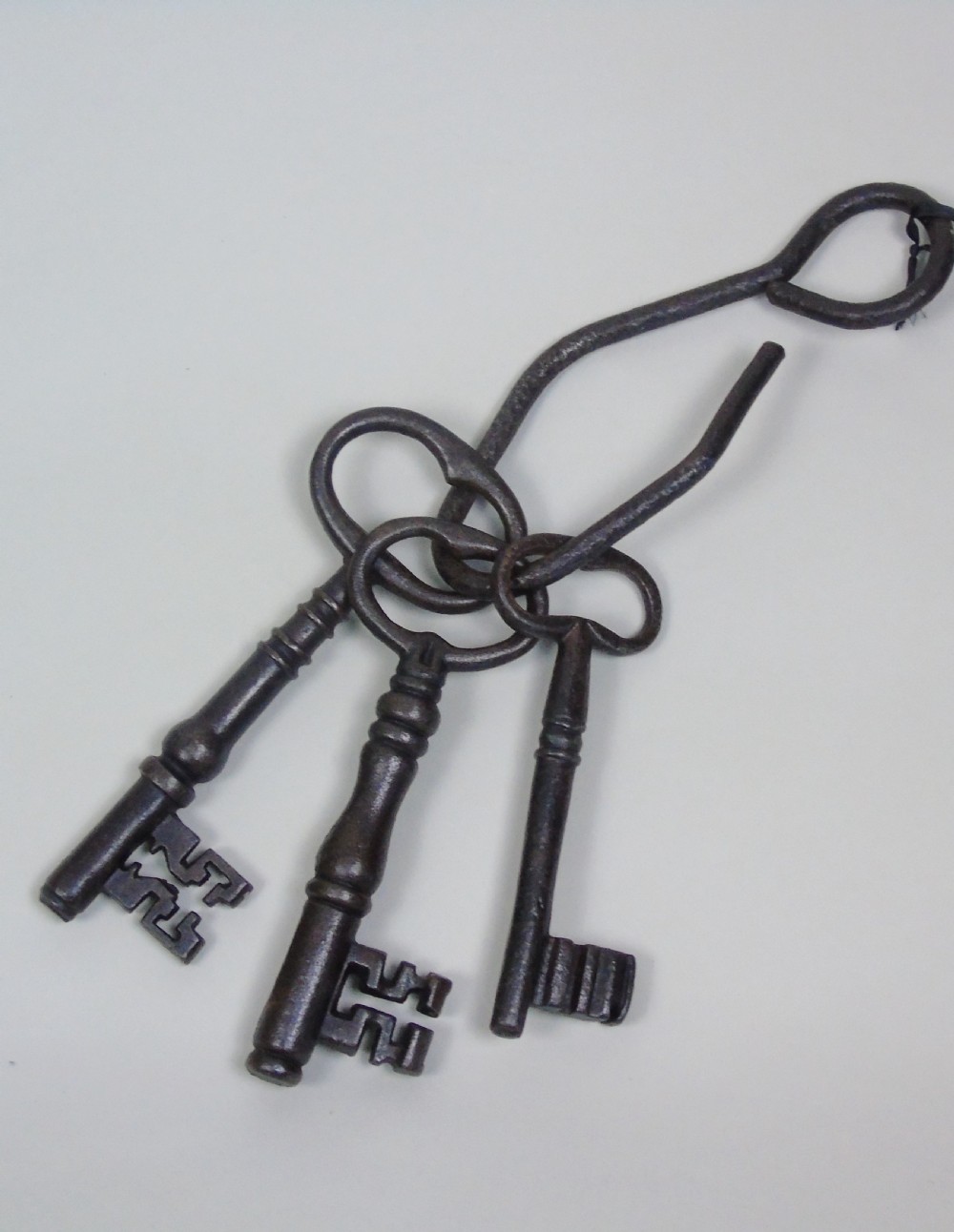Massive Antique Iron Keys On Beaten Iron Hook