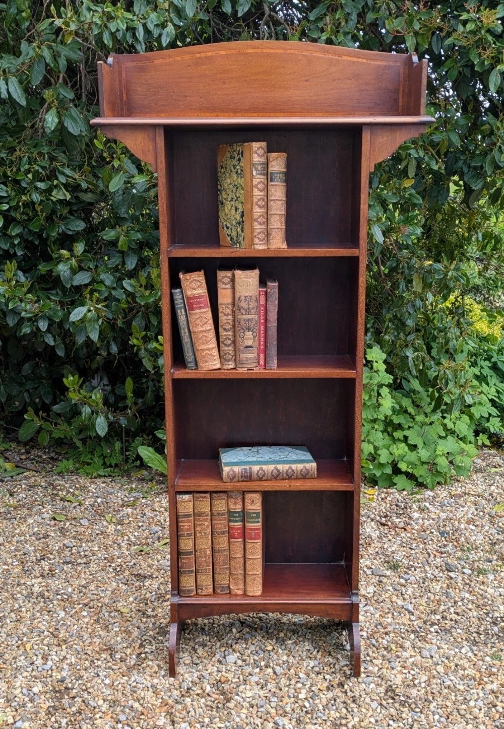 A tall, narrow Edwardian mahogany open bookcase with string inlay, featuring four open shelves and a raised gallery back. View VII