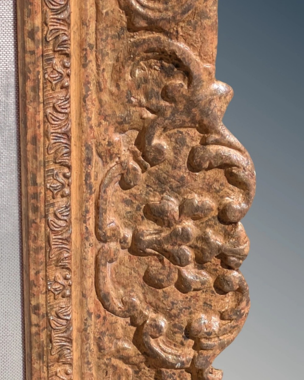 A large rectangular Montparnasse picture frame featuring ornate carved shell and scroll motifs with a cream linen inner slip. View V