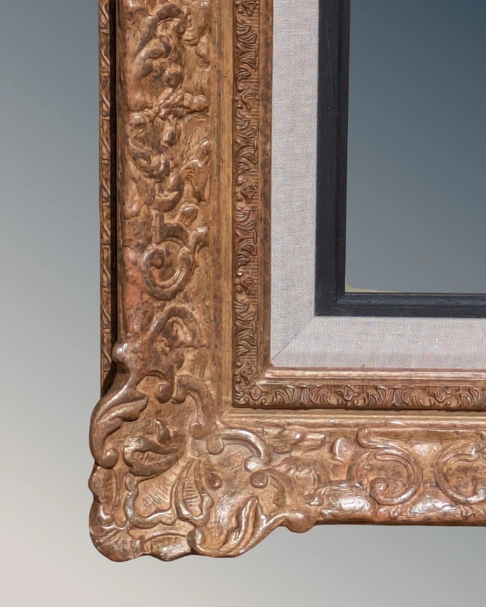 A large rectangular Montparnasse picture frame featuring ornate carved shell and scroll motifs with a cream linen inner slip. View VI