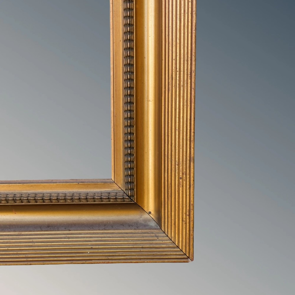 A rectangular antique gilt picture frame featuring a reeded outer border, a deep cove profile, and beaded inner moulding. View II
