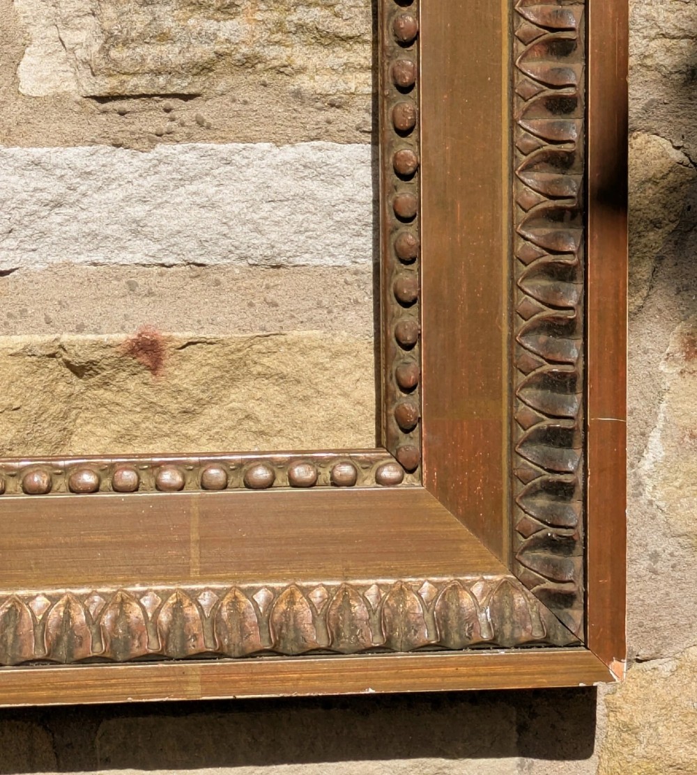 An early twentieth-century rectangular giltwood picture frame featuring classical egg and dart outer moulding and an inner beaded border. View V
