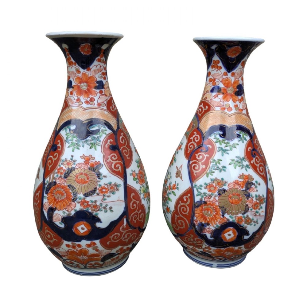 A pair of pear-shaped Japanese Imari porcelain vases decorated with cobalt blue, iron-red, and gold floral panels. View III