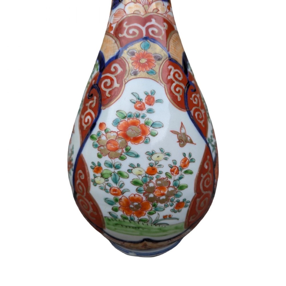 A pair of pear-shaped Japanese Imari porcelain vases decorated with cobalt blue, iron-red, and gold floral panels. View IV
