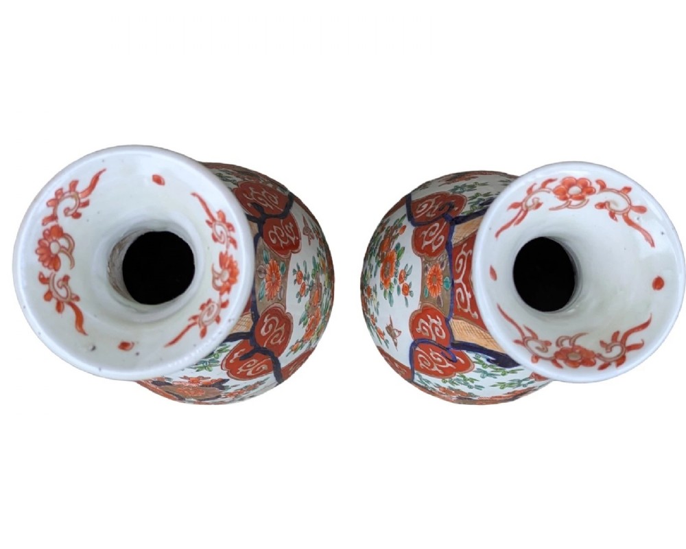 A pair of pear-shaped Japanese Imari porcelain vases decorated with cobalt blue, iron-red, and gold floral panels. View VII