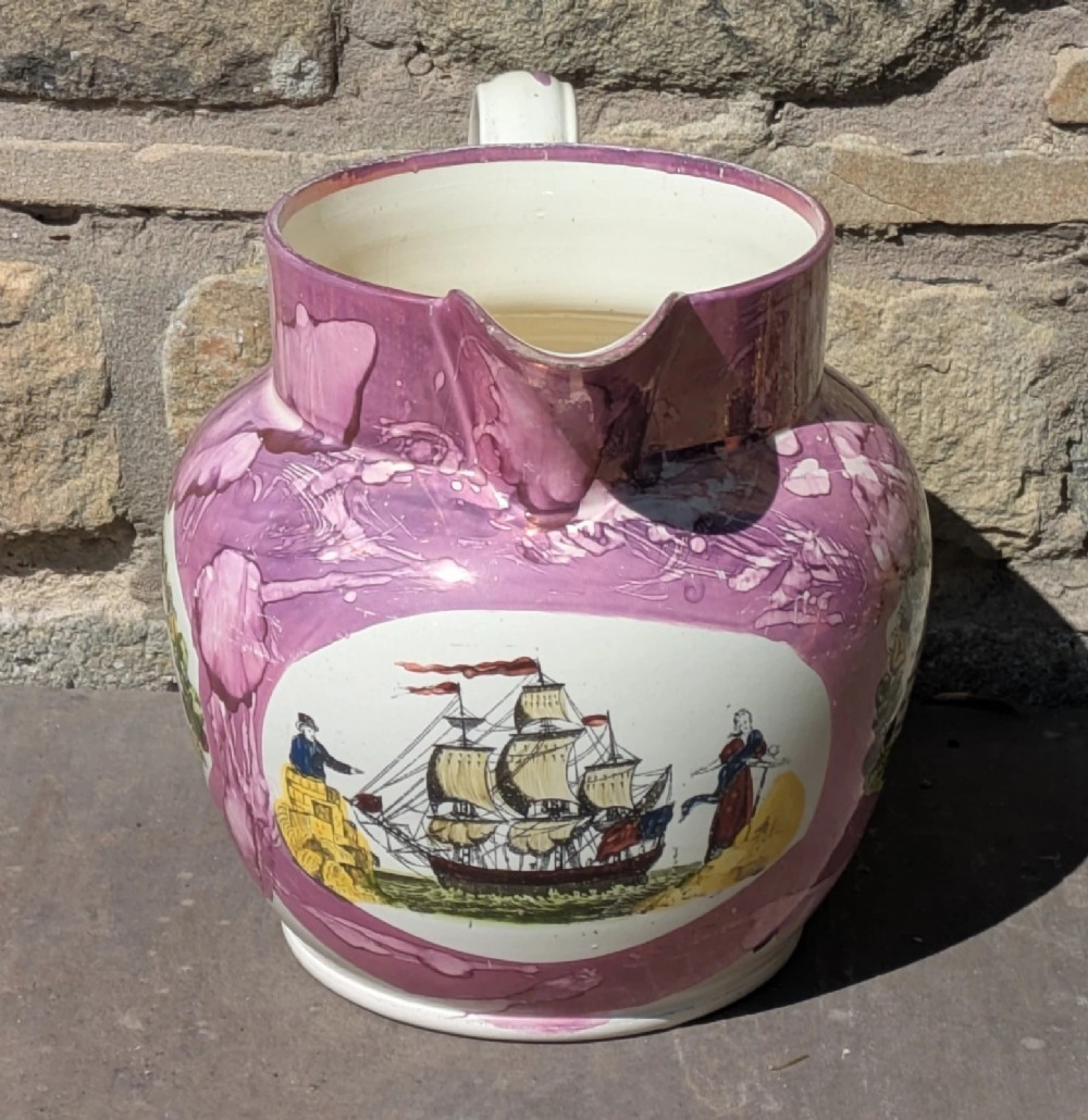 An antique pink lustreware ceramic jug featuring marbled metallic pink glazing and a transfer-printed maritime verse in a central panel. View II