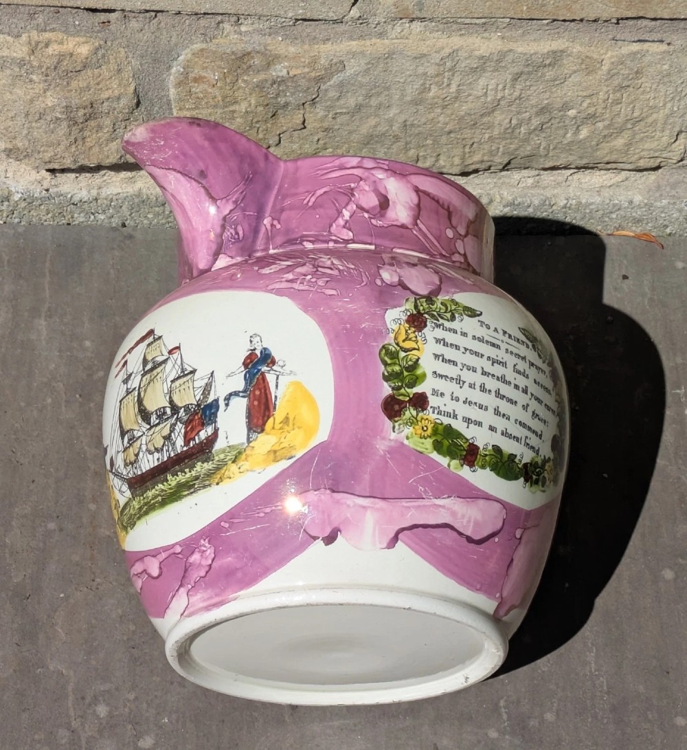 An antique pink lustreware ceramic jug featuring marbled metallic pink glazing and a transfer-printed maritime verse in a central panel. View V