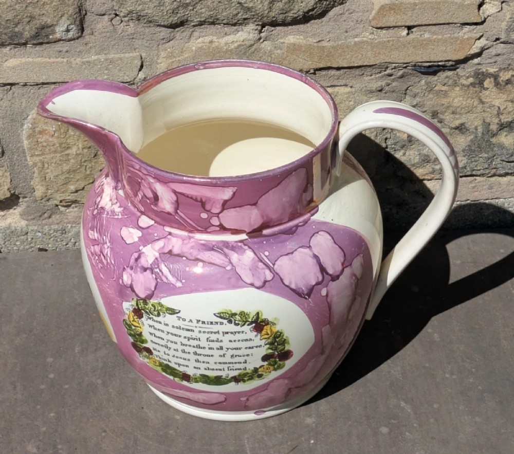 An antique pink lustreware ceramic jug featuring marbled metallic pink glazing and a transfer-printed maritime verse in a central panel. View VI