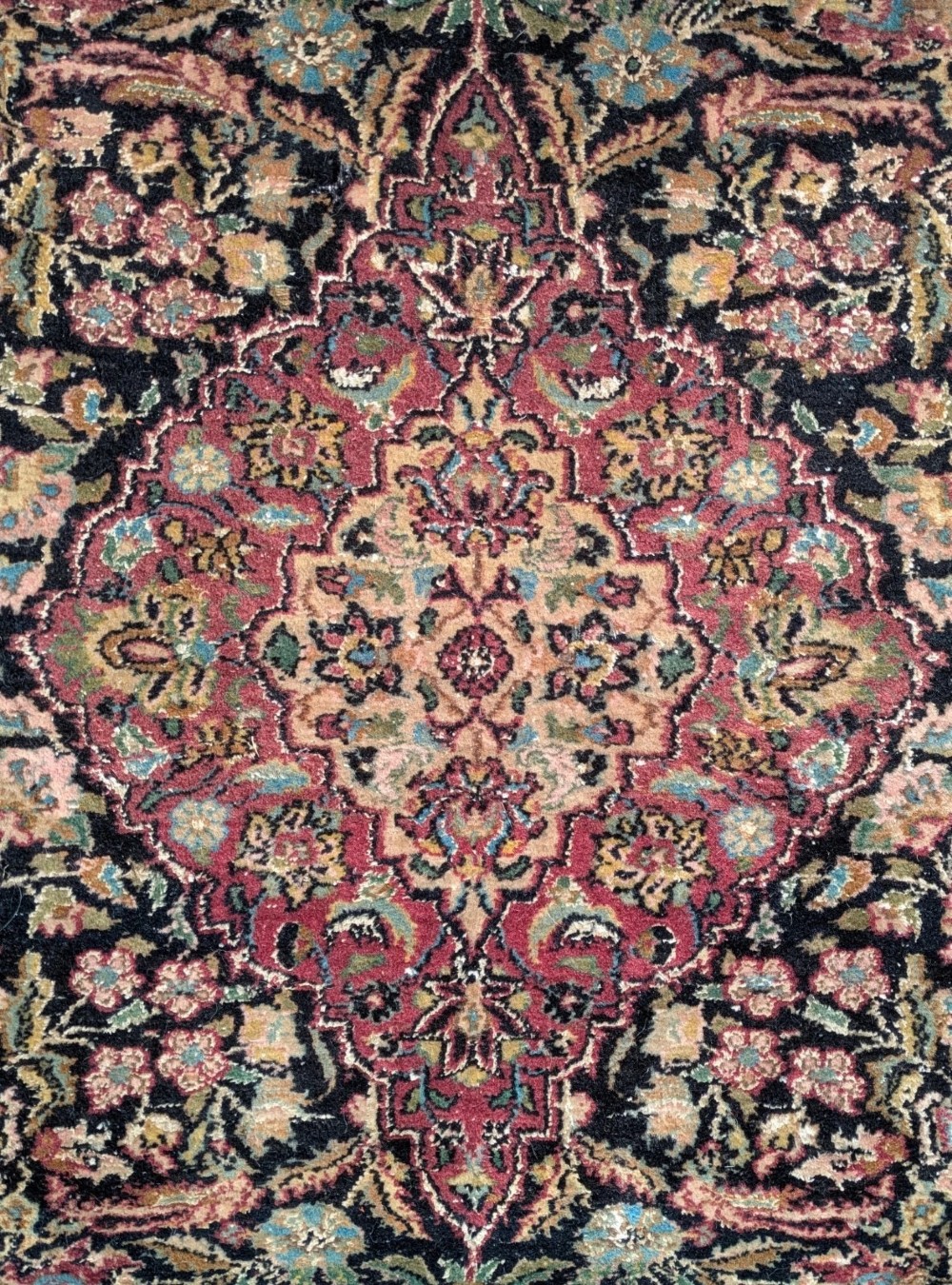 A hand-knotted Isfahan carpet featuring a detailed central medallion surrounded by floral scrollwork and cartouche borders in shades of rose, dark navy, cream, and turquoise. View II