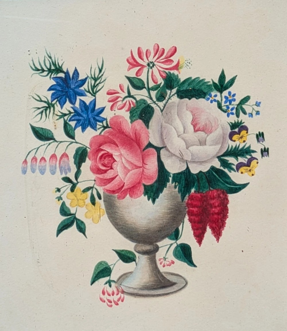 A framed Regency watercolour painting depicting a vibrant floral bouquet in an urn, set within a wide burr wood frame featuring a brass suspension ring. View V