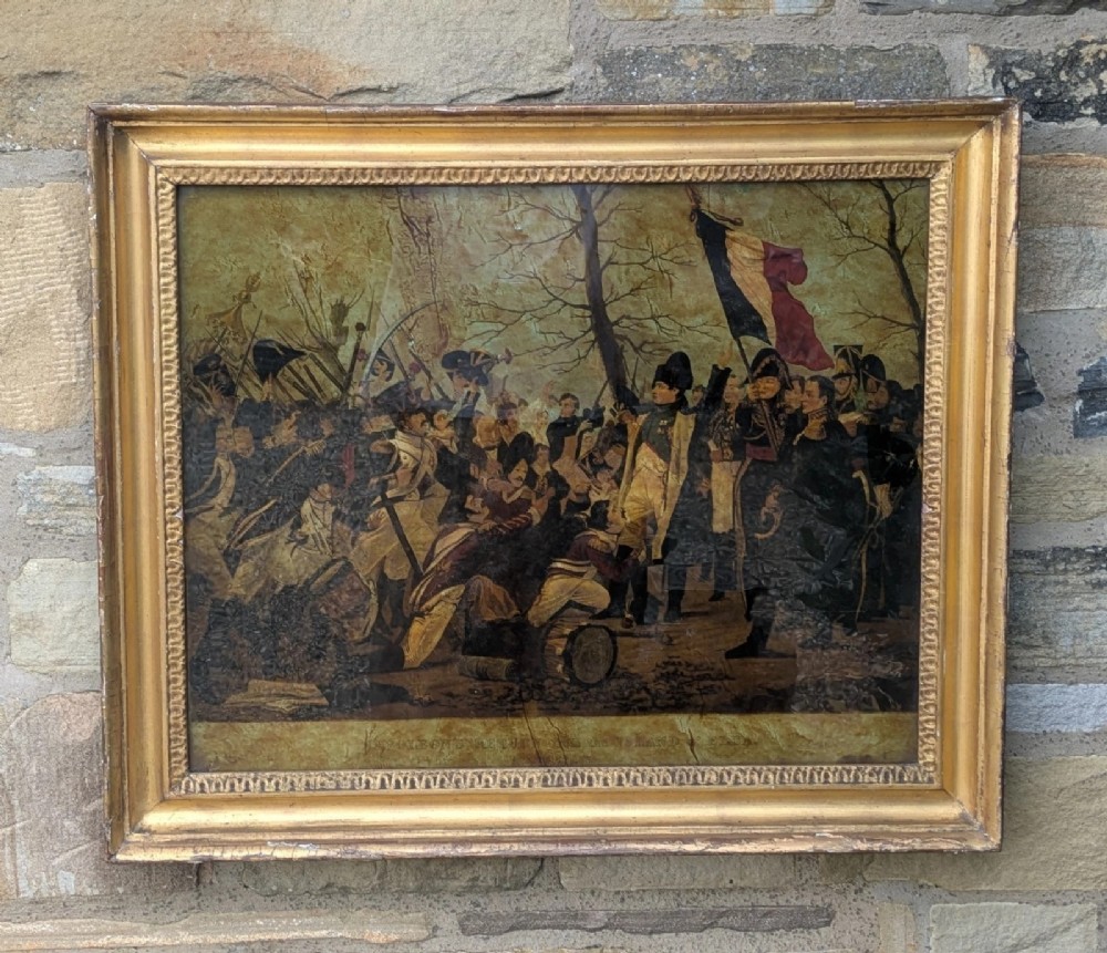 A 19th-century framed crystoleum glass print depicting Napoleon Bonaparte amongst soldiers returning from Elba, set inside a moulded gold gilt frame. View VI