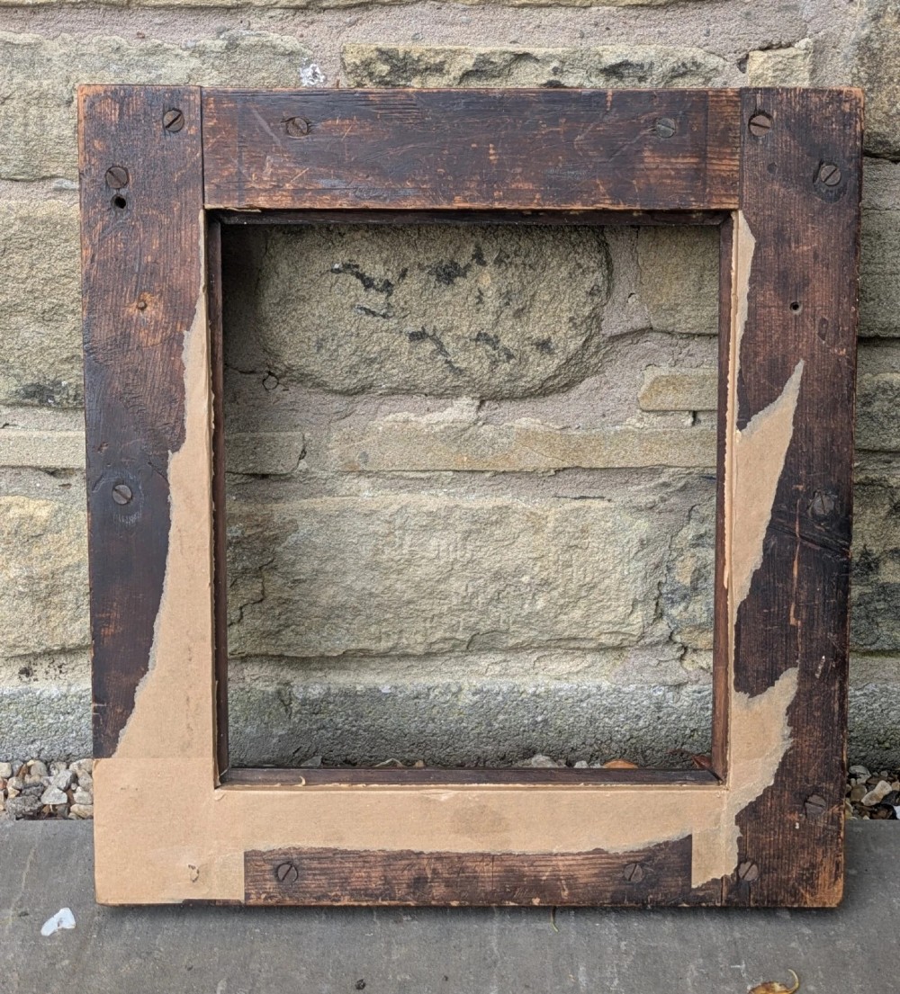 A rectangular antique solid walnut picture frame featuring multi-tiered moulding and mitred corners. View VII