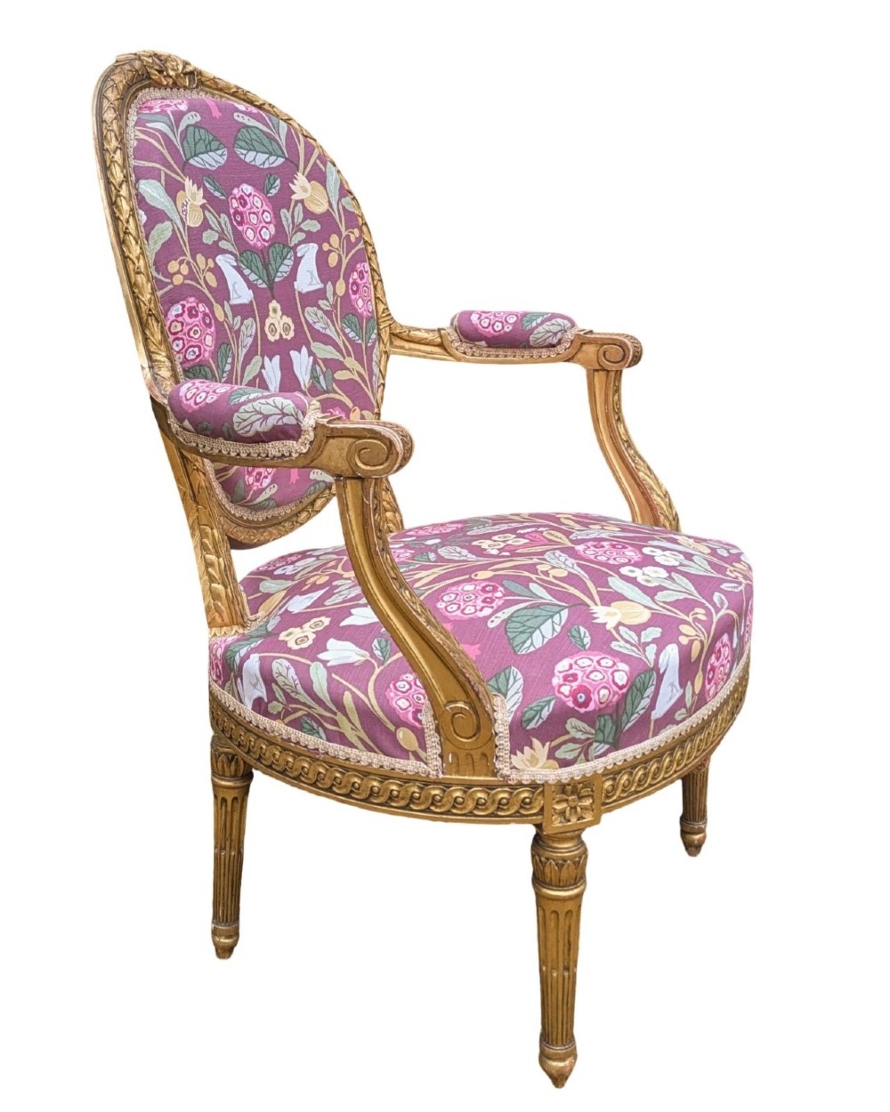 A pair of carved giltwood French armchairs featuring oval medallion backs and floral patterned plum-coloured upholstery. View VIII