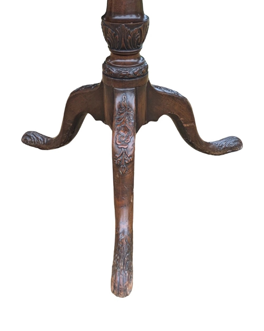 A Georgian mahogany tilt-top table with a scalloped piecrust edge shown in a raised vertical position above a turned pedestal and carved tripod cabriole legs. View VII