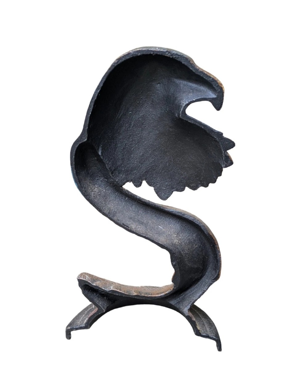 A cast iron doorstop styled as a sculpted eagle head resting on a stylized curved feather base set upon a round plinth. View V