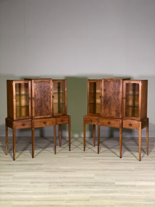 A PAIR OF WALNUT CABINETS BY ARTHUR REYNOLDS OF LUDLOW