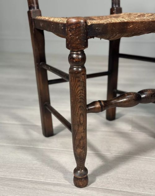 A PAIR OF ANTIQUE ELM RUSH LADDERBACK CHAIRS - ADDITIONAL PHOTO 1