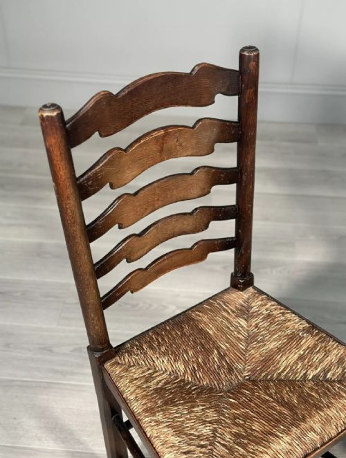 A PAIR OF ANTIQUE ELM RUSH LADDERBACK CHAIRS - ADDITIONAL PHOTO 2