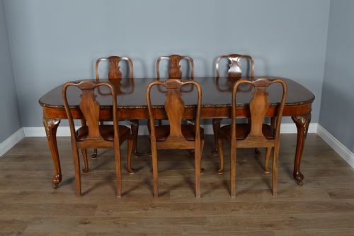 fig 1. Antique walnut two leaf wind out dining table and 6 chairs by Merryweather of Holloway London