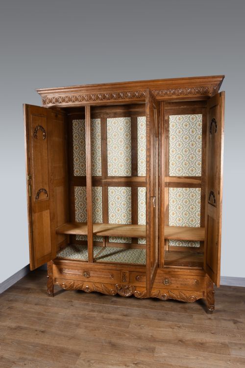 fig 1. carved oak flat pack triple wardrobe