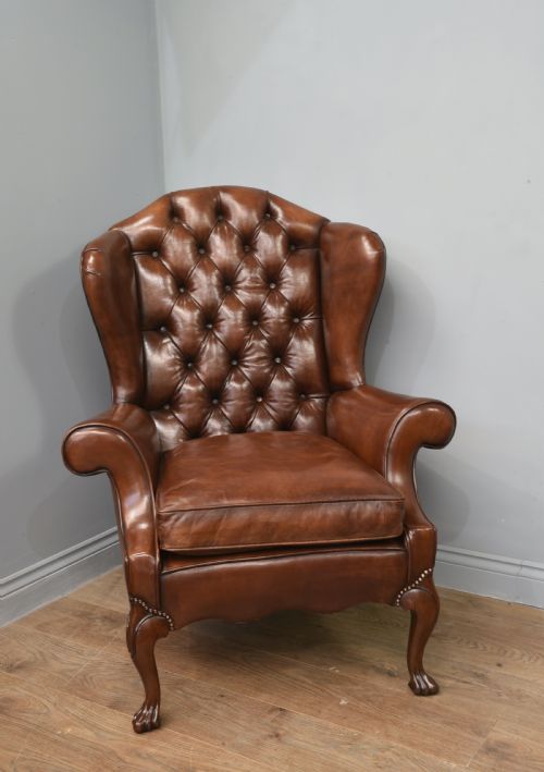 fig 1. Antique leather wing chair