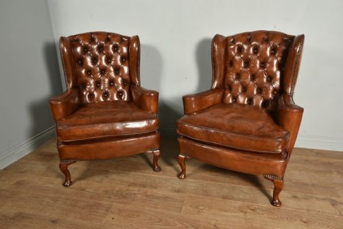 Antique Pair of Deep Buttoned Leather Wing Chairs