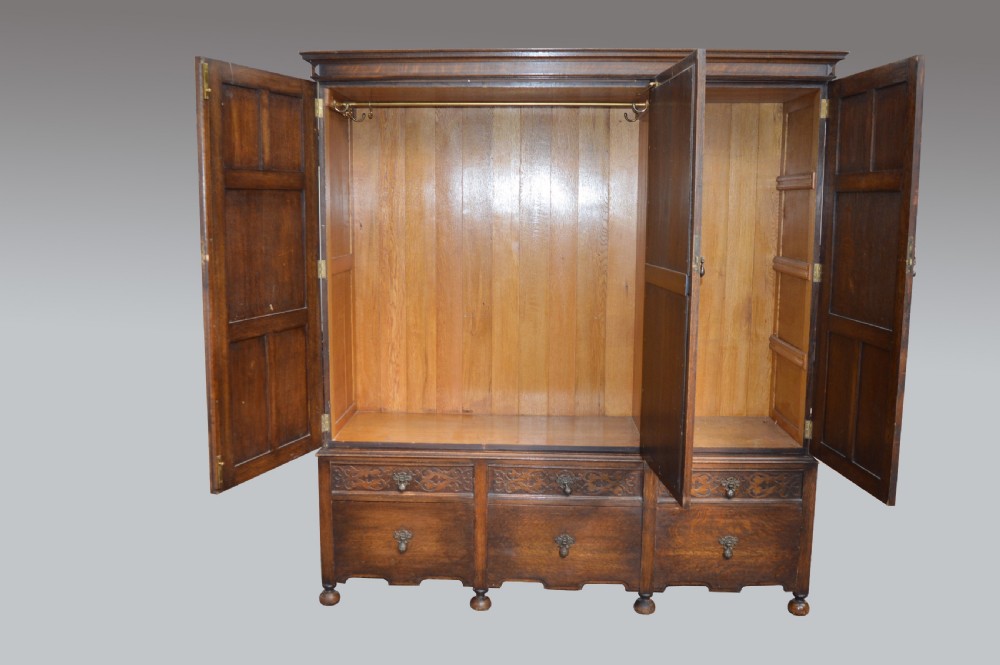 Oak Jacobean style triple wardrobe  View II