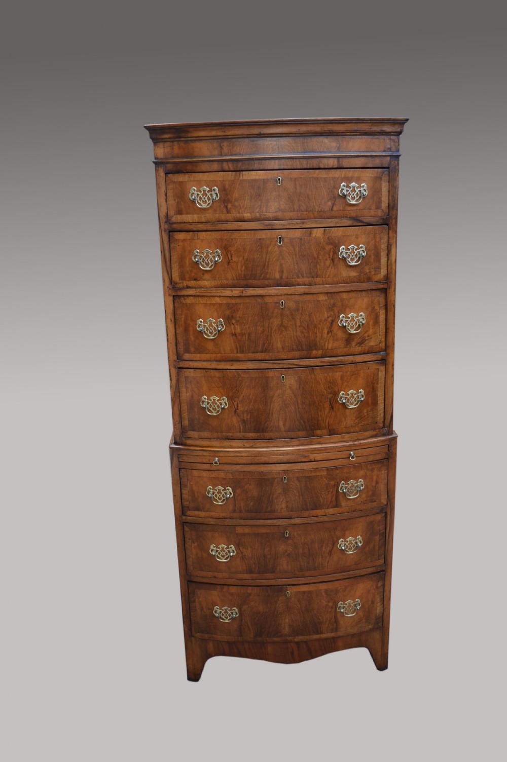 walnut bow front chest on chest 