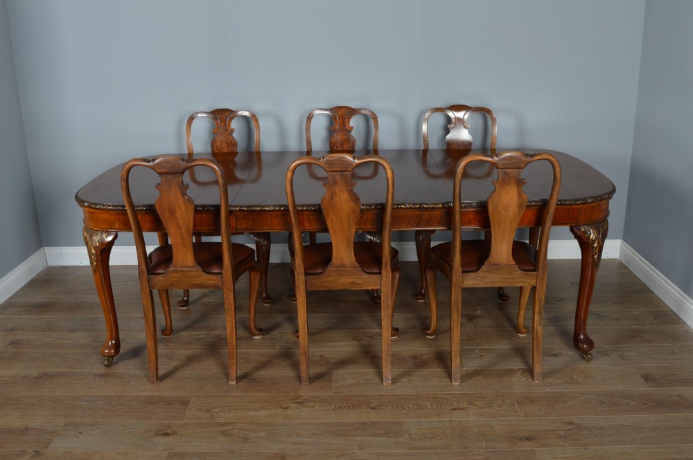 Antique walnut two leaf wind out dining table and 6 chairs by Merryweather of Holloway London  View II