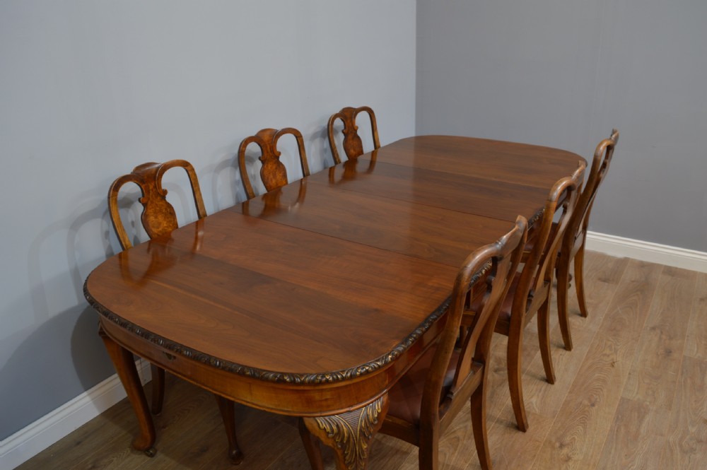 Antique walnut two leaf wind out dining table and 6 chairs by Merryweather of Holloway London  View III