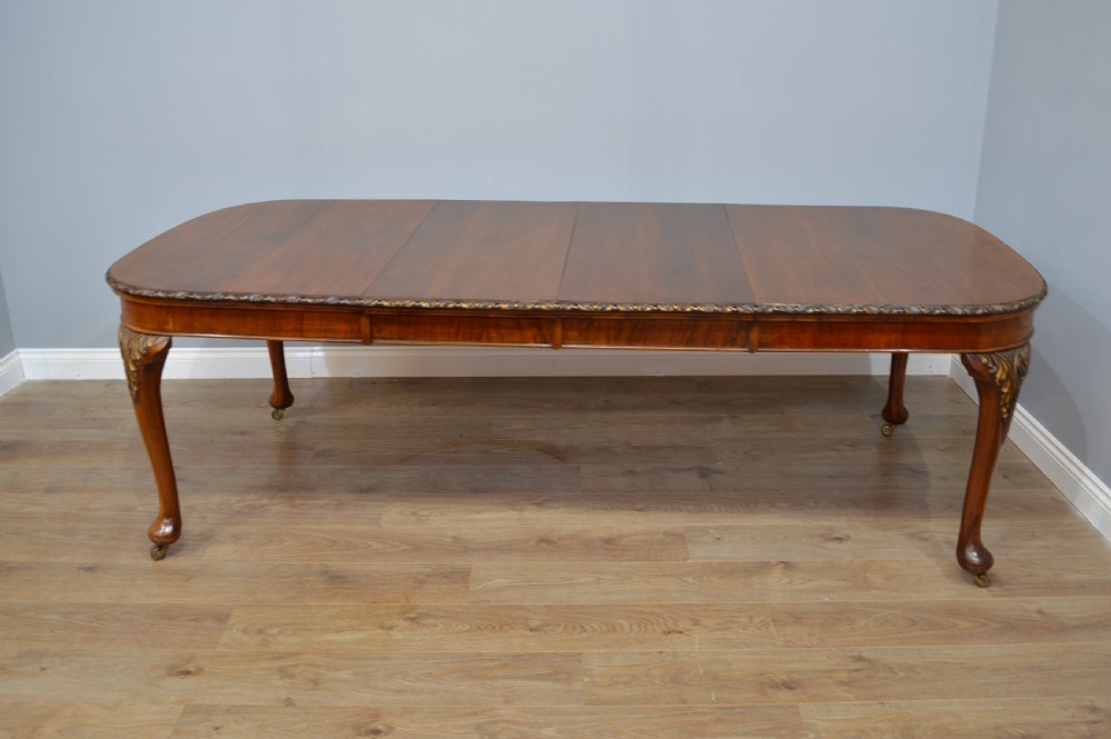 Antique walnut two leaf wind out dining table and 6 chairs by Merryweather of Holloway London  View IV