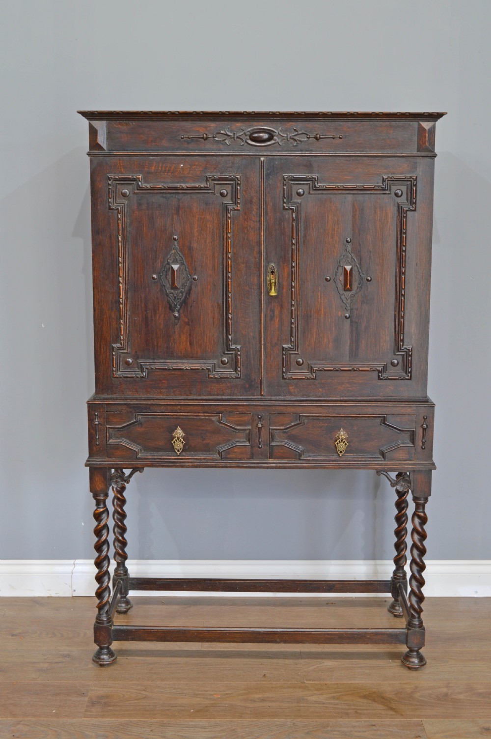 Jacobean style oak cupboard on stand 