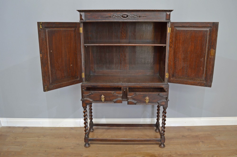Jacobean style oak cupboard on stand  View III
