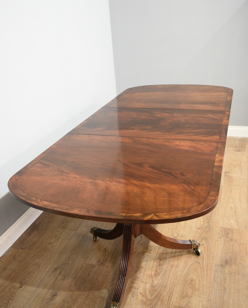 late 19th century Regency style mahogany twin pillar dining table  View II